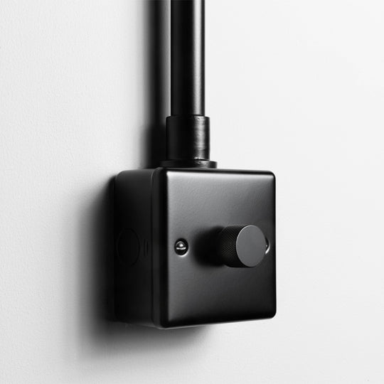 Matt Black 1 Gang 2 Way LED Dimmer Switch With Back Box And Conduit On A Light Grey Background