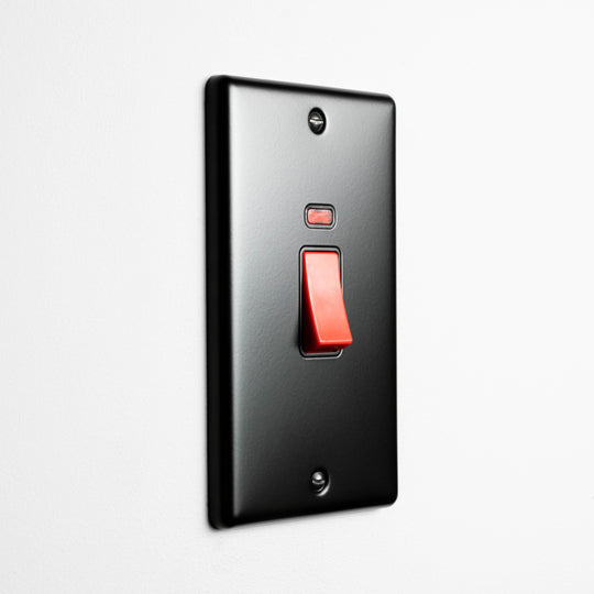 Matt Black 2 gang 45A Double Pole Switch On A Light Grey Background
