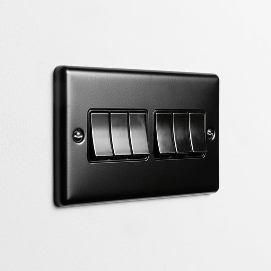 Matt Black 6 Gang 2 Way Switch With Black Insert On Light Grey Background