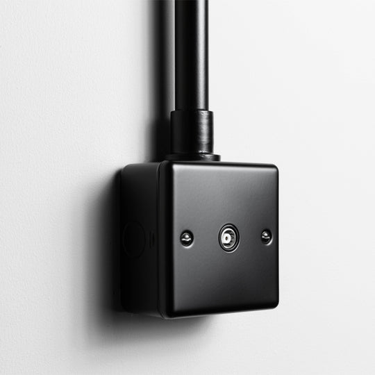Matt Black Aerial Socket With Back Box And Conduit On A Light Grey Background
