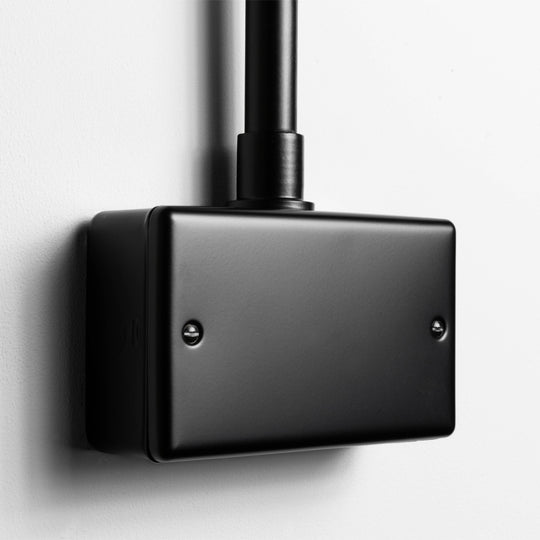 Matt Black Double Blank Plate With Back Box And Conduit On A Light Grey Background