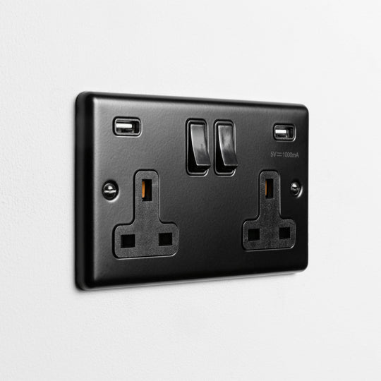Matt Black Double Socket With Twin USB A On A Light Grey Background