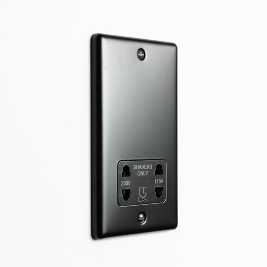 Matt Black Dual Voltage Shaver Socket On A Light Grey Background