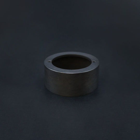 A dark bronze 20mm conduit loop in back box, displayed against a dark background.