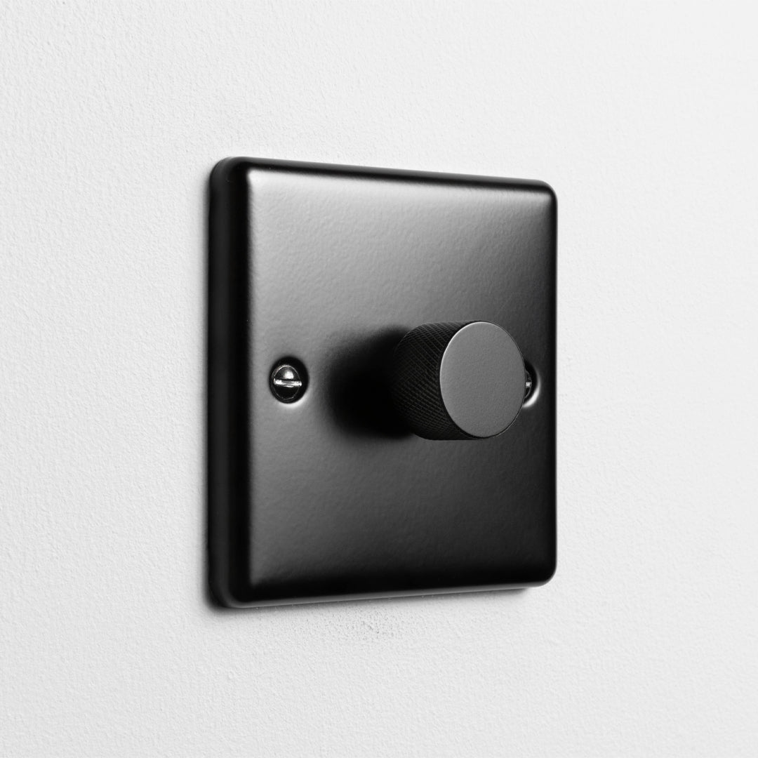 Matt Black 1 Gang 2 Way LED Dimmer Switch On A Light Grey Background