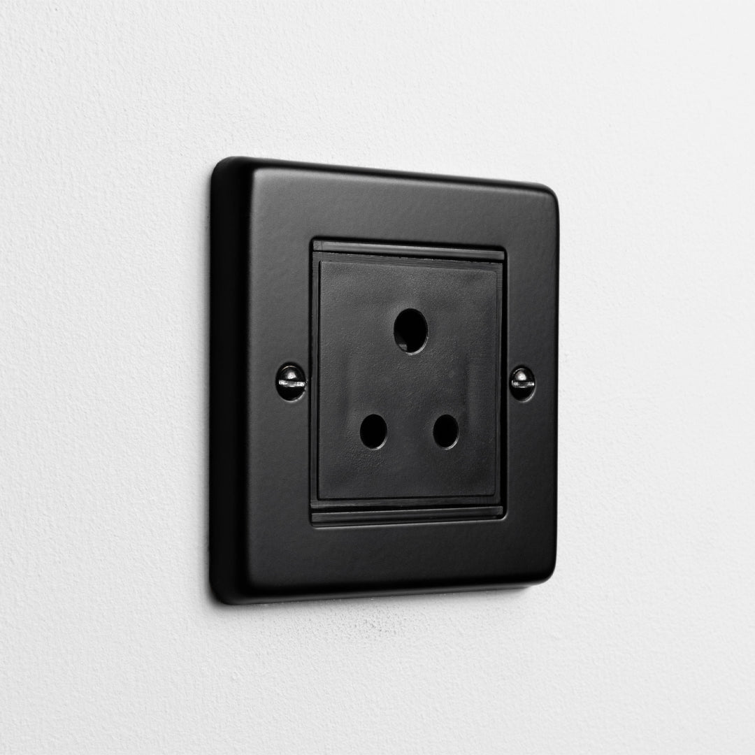 Matt Black 5A Socket On A Light Grey Background