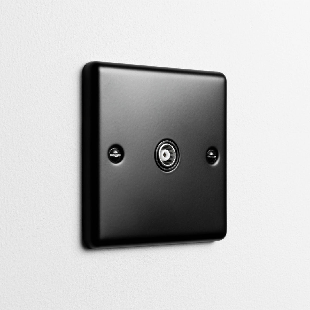 Matt Black Aerial Socket On A Light Grey Background