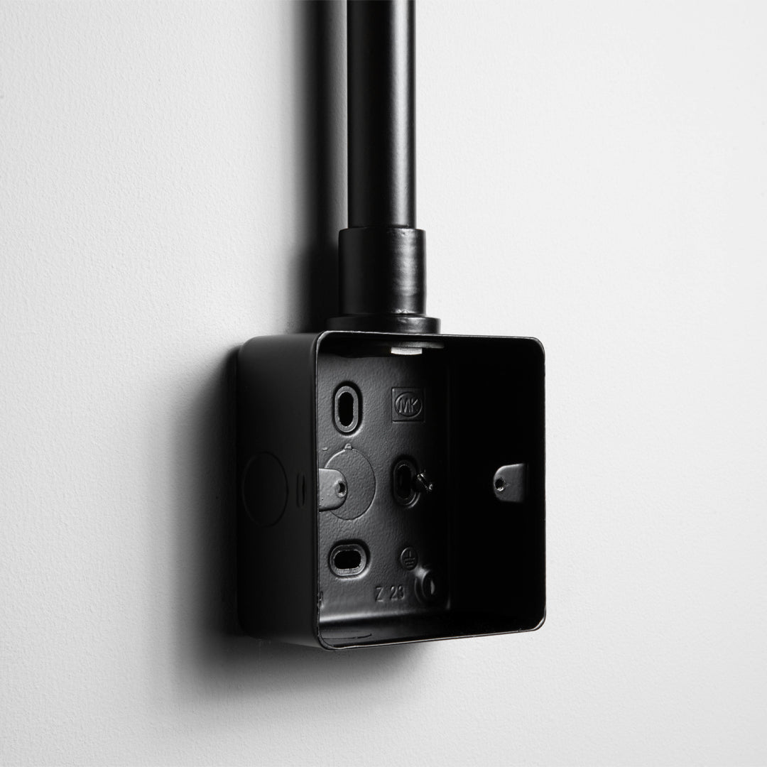 Matt Black Back Box With Conduit On A Light Grey Background