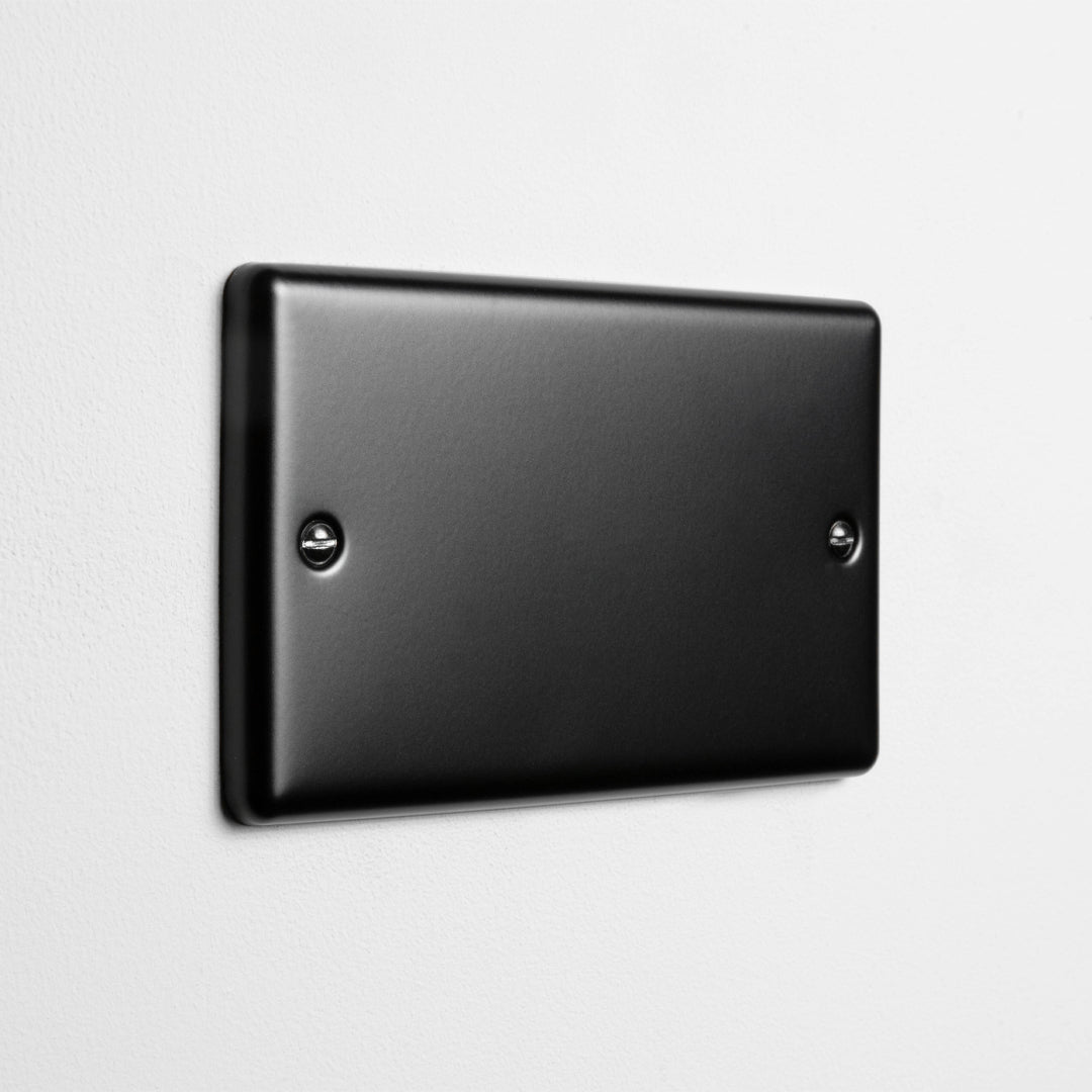 Matt Black Double Blank Plate On A Light Grey Background
