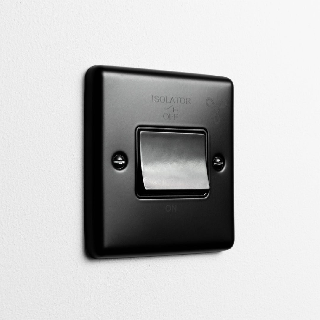 Matt Black 6A Fan Switch On A Light Grey Background