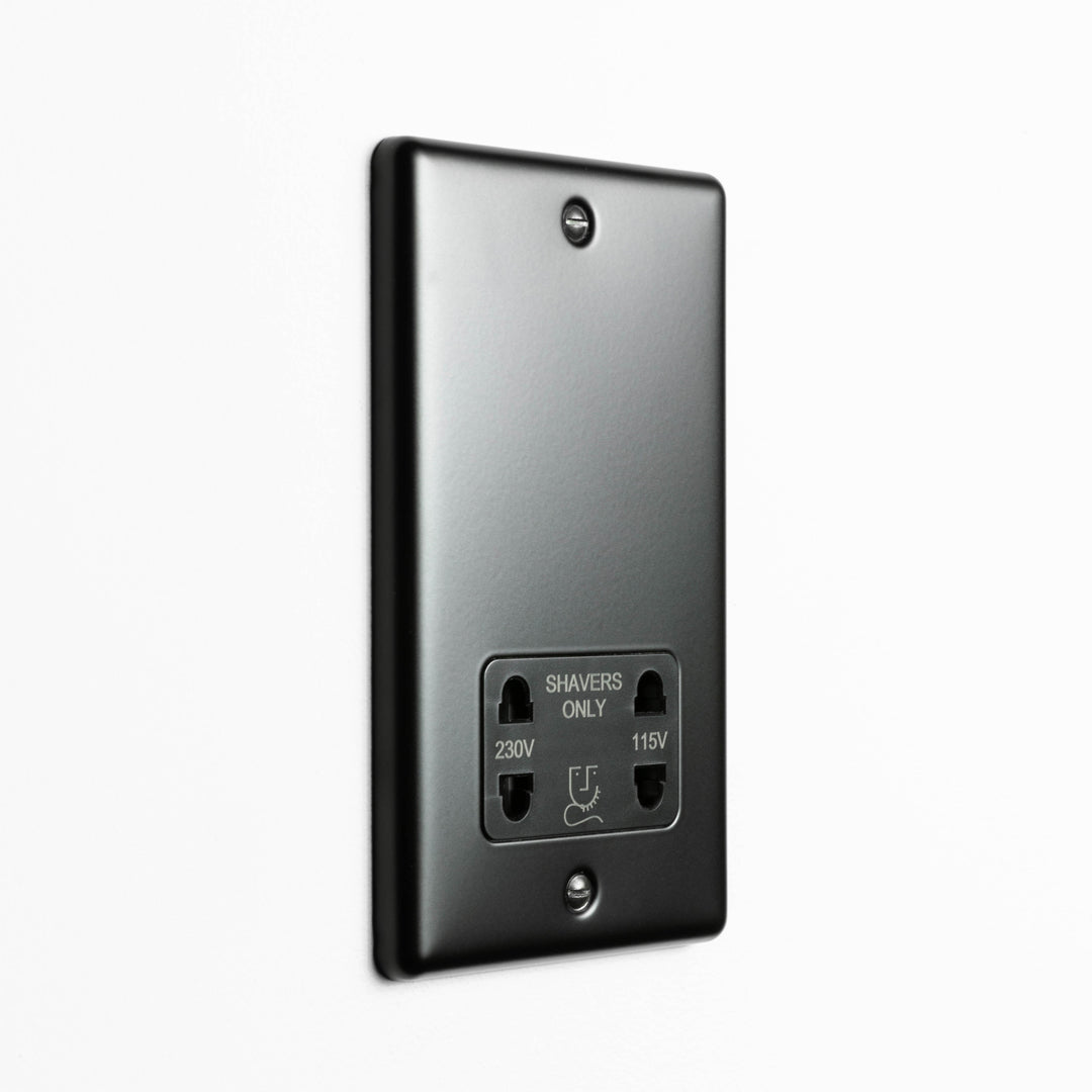 Matt Black Dual Voltage Shaver Socket On A Light Grey Background