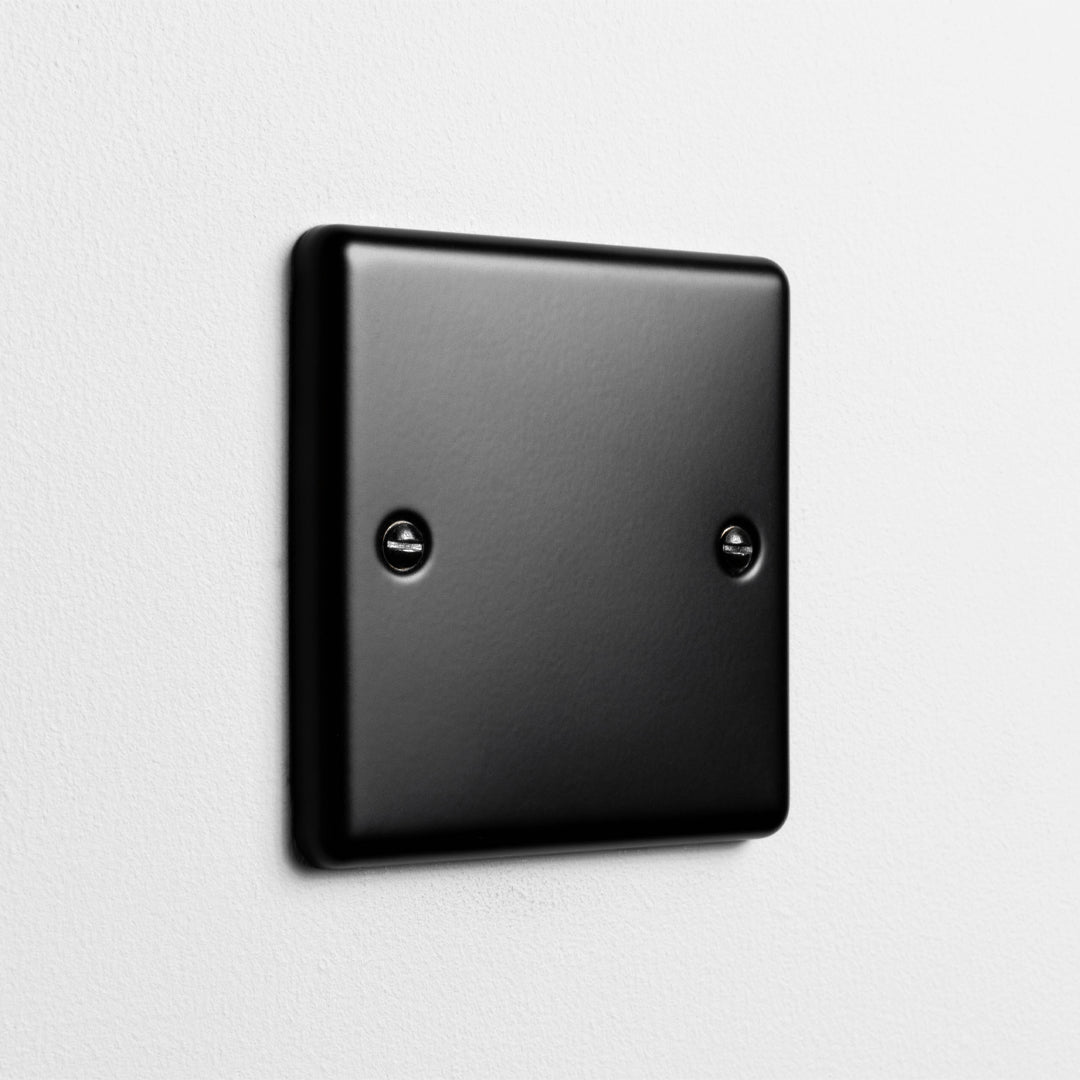 Matt Black Single Blank Plate On A Light Grey Background