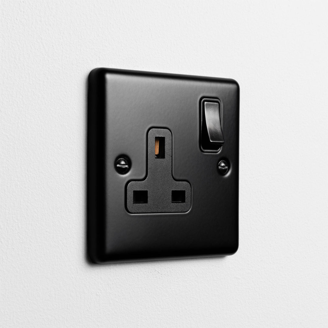 Matt Black Single Socket On A Light Grey Background