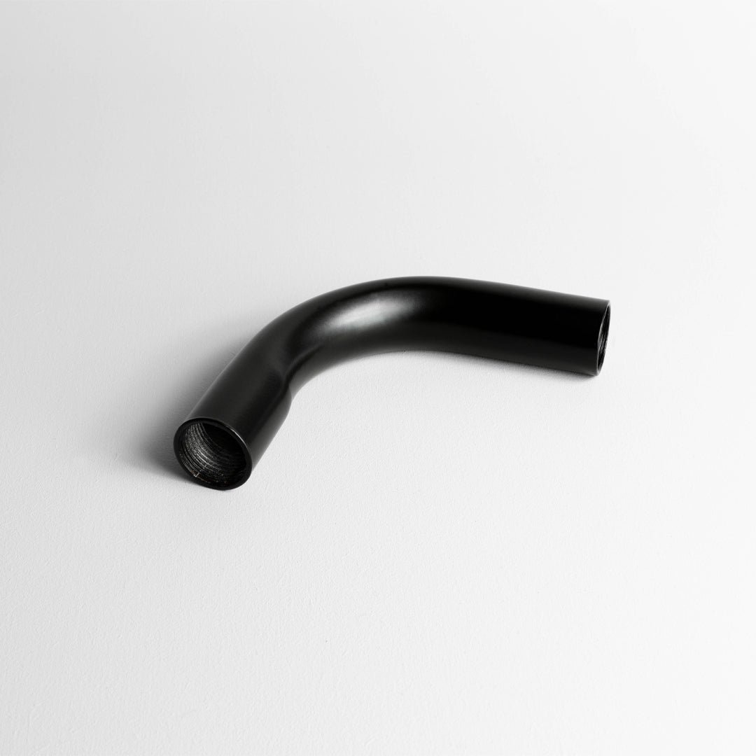 Matt Black 20mm Conduit Solid Bend On A Light Grey Background