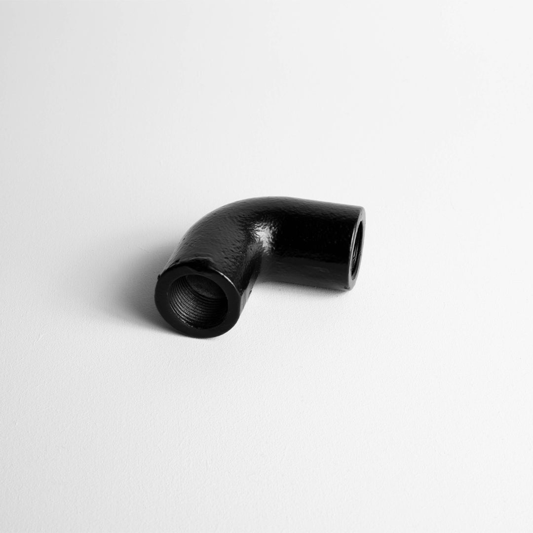 Matt Black 20mm Conduit Solid Elbow ON A Light Grey Background